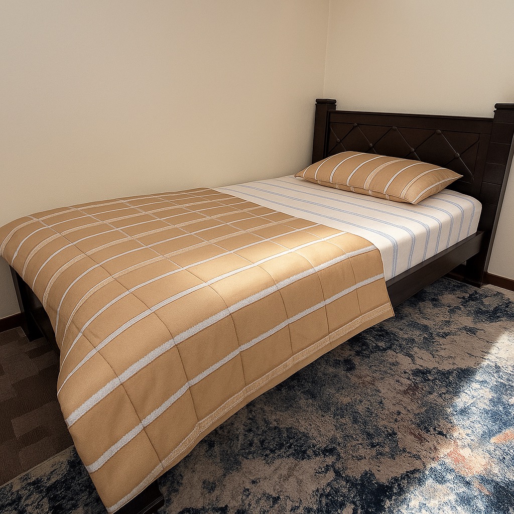 Amber Suite bedroom with a warm beige bedspread