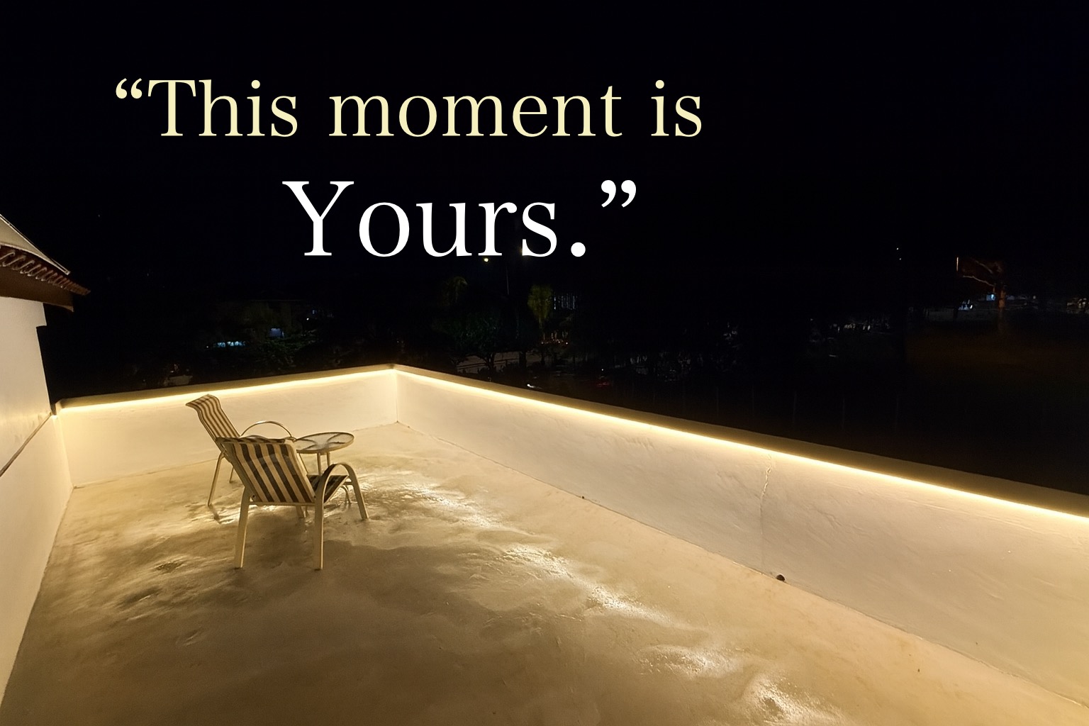 Open-air upper terrace at Villa Rinting at night